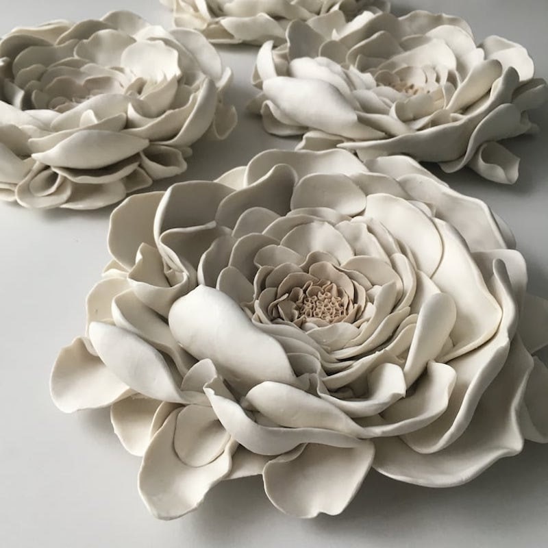 Three dimensional clay flower wall decor from Etsy