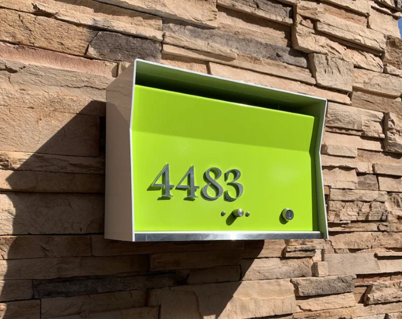 Green and white metal wall-mounted mailbox