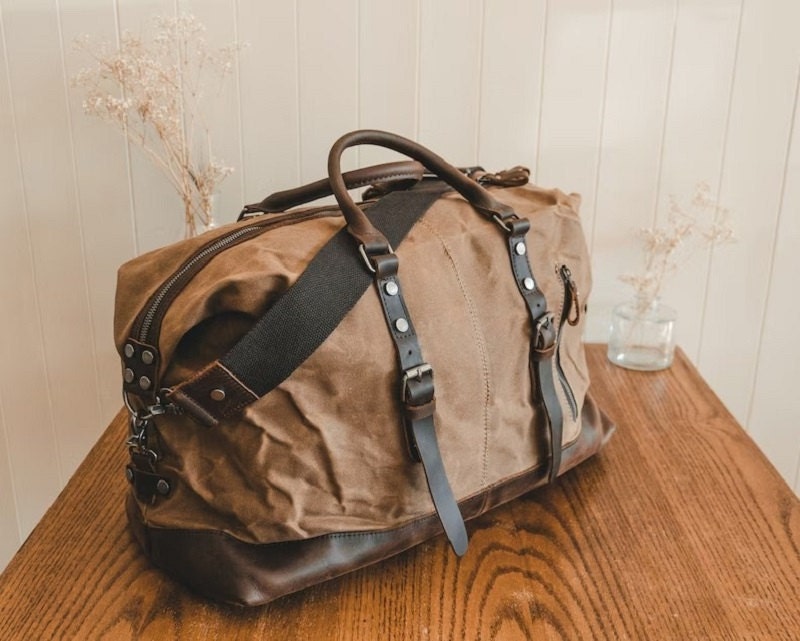 College graduation gift idea - light brown waxed canvas duffel with dark leather straps