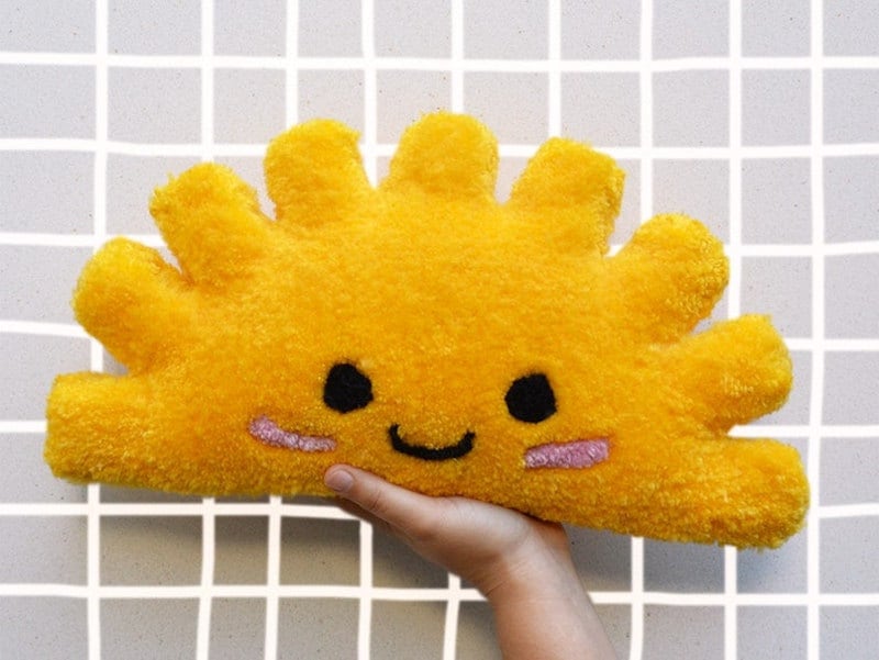 A yellow half-sun pillow from Etsy.