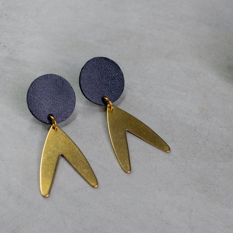 Leather and brass earrings from Tiramaka Rohi on Etsy.