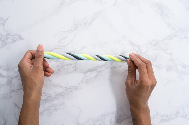 Hands twisting clay. Hands twisting clay.