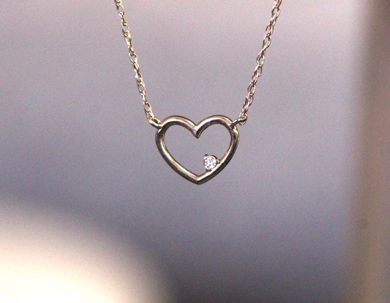 Heart-shaped gold necklace with diamond from Etsy