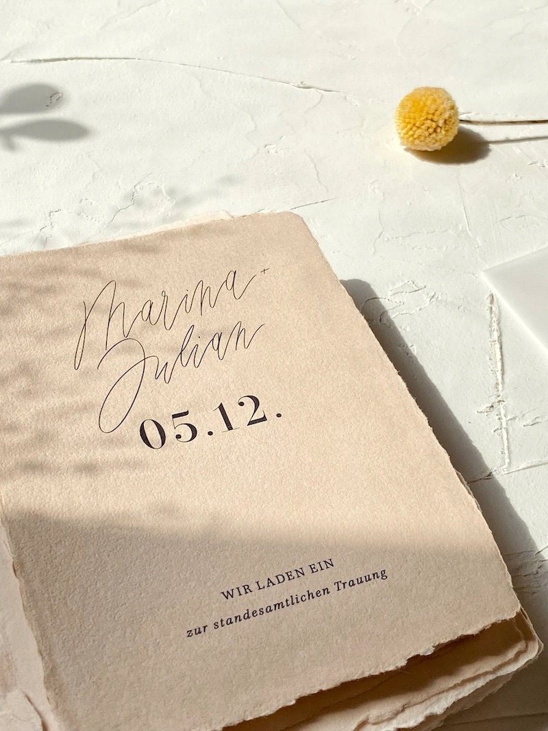 Handmade paper wedding invitations from Etsy