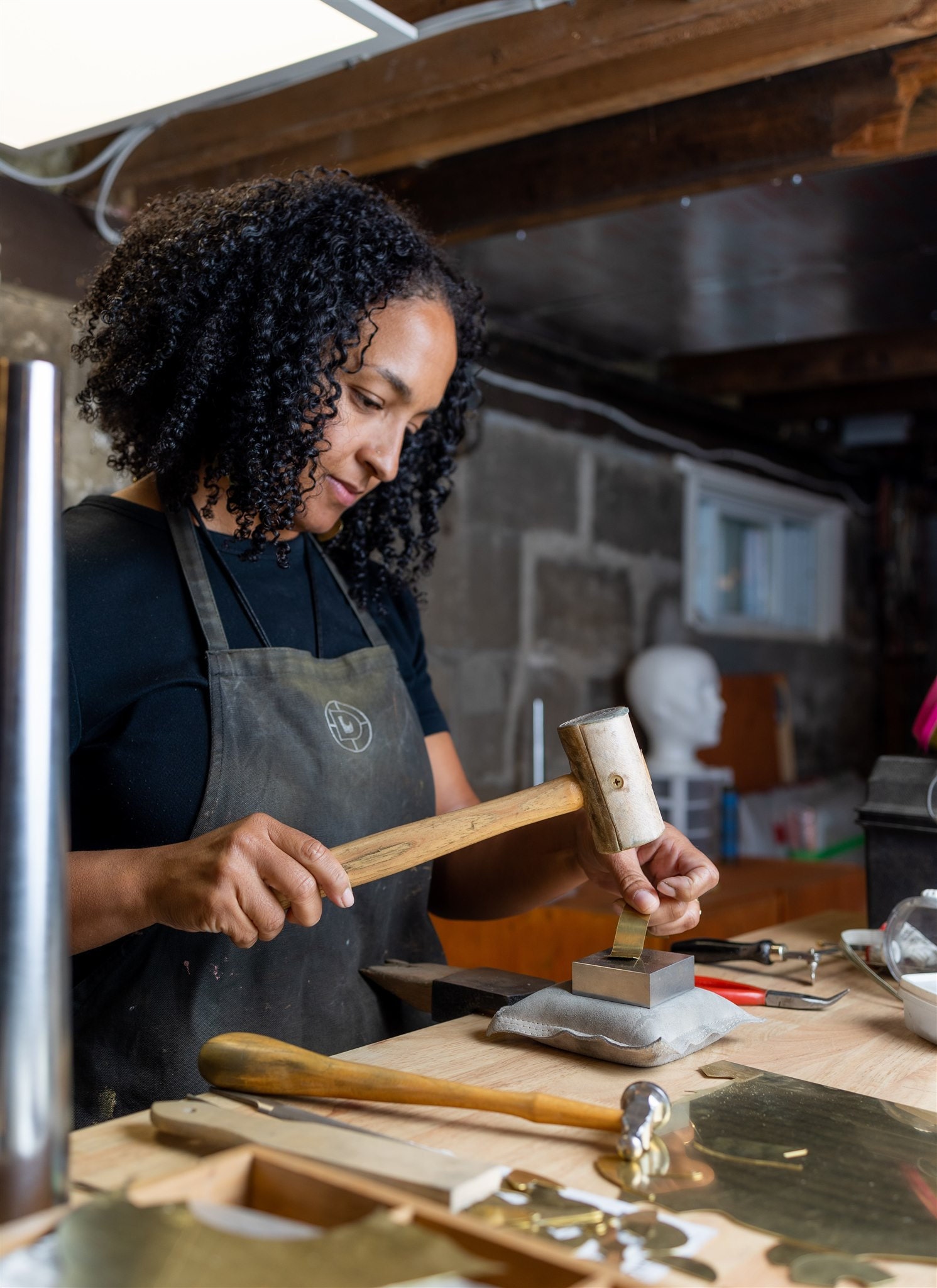 Jordan Clarke making jewelry in her studio.