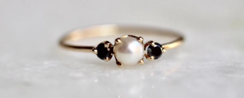 Gold pearl and black diamond ring