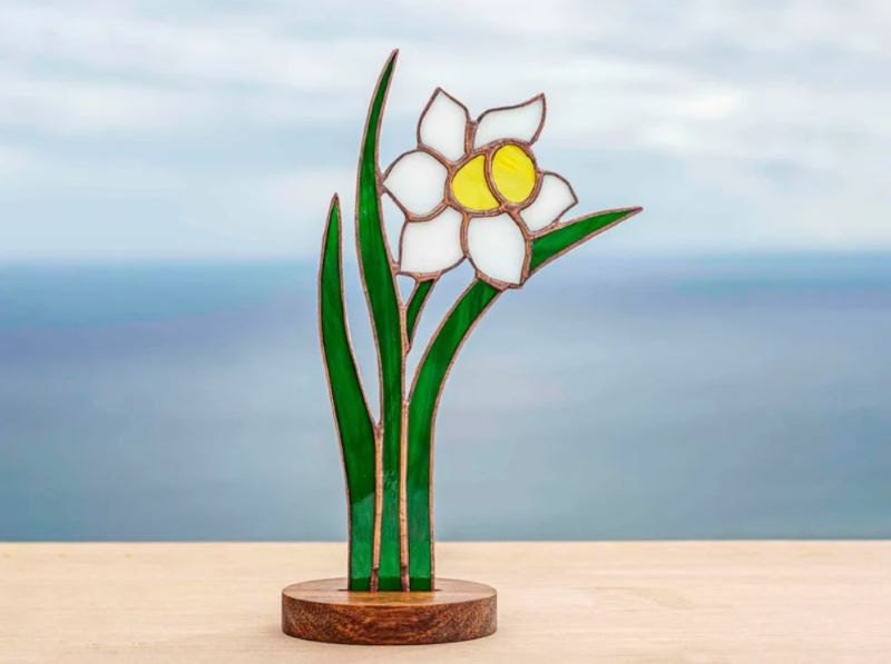 Stained glass flower on wooden stand