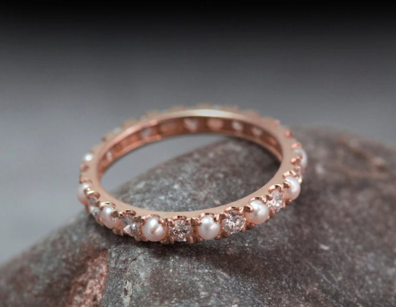 Rose gold eternity ring with diamonds and pearls