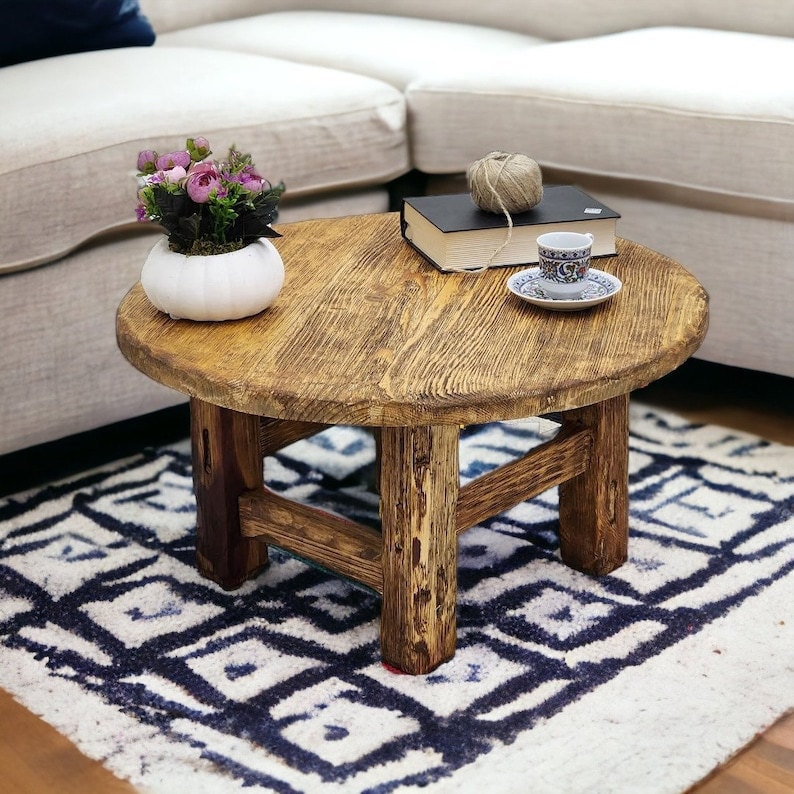 Wooden coffee table on blue and white rug