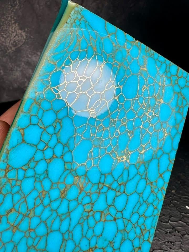 “Turquoise blue synthetic stone slab with golden veins by Mohit Impacts, inspired by western turquoise for jewelry, pen turning and knife handles.”