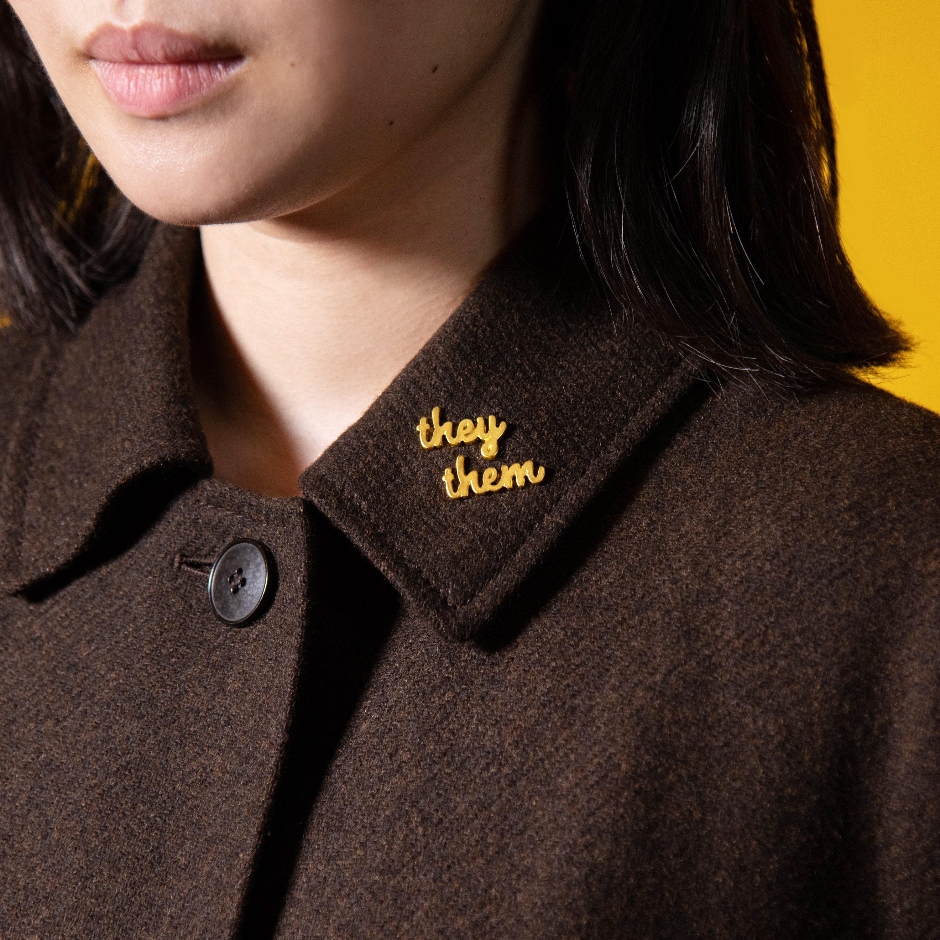 Small they/them pronoun pins featuring the non-binary pronouns they and them. The pins are discreet and minimalist in design, making them suitable for any outfit. These pins are a way for individuals who use they/them pronouns to express their gender identity and promote visibility and acceptance of non-binary identities.