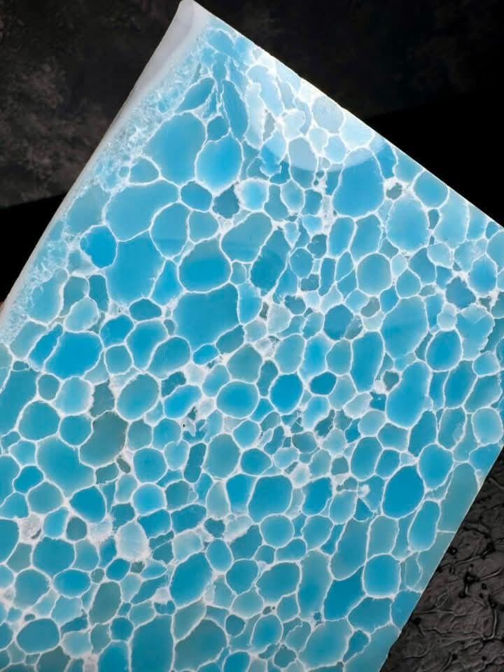 “Ice blue translucent synthetic crystal slab by Mohit Impacts, frozen jade texture with soft cellular pattern for luxury jewelry and custom knives.”