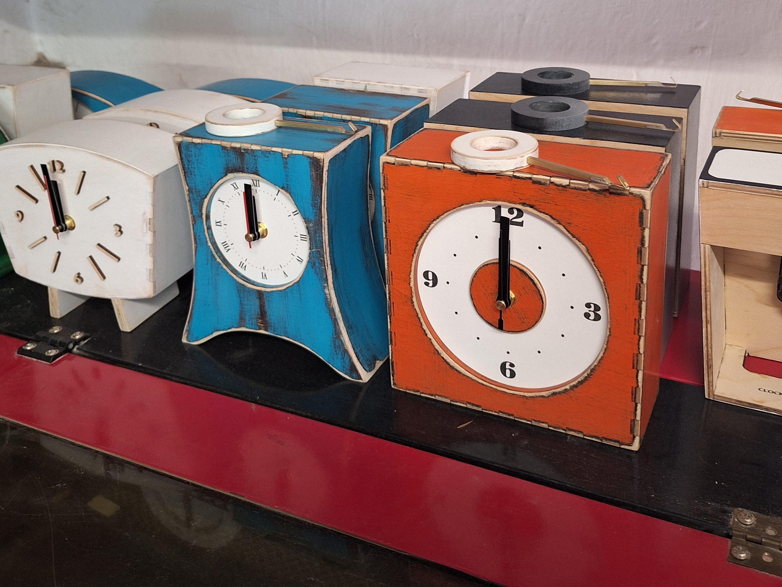 Collection of handcrafted wooden clocks by ClockWoodStudio