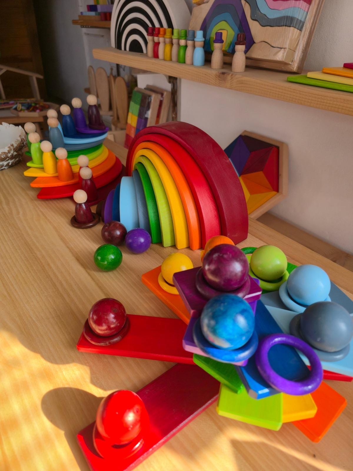 Handmade wooden rainbow stacker crafted from natural wood