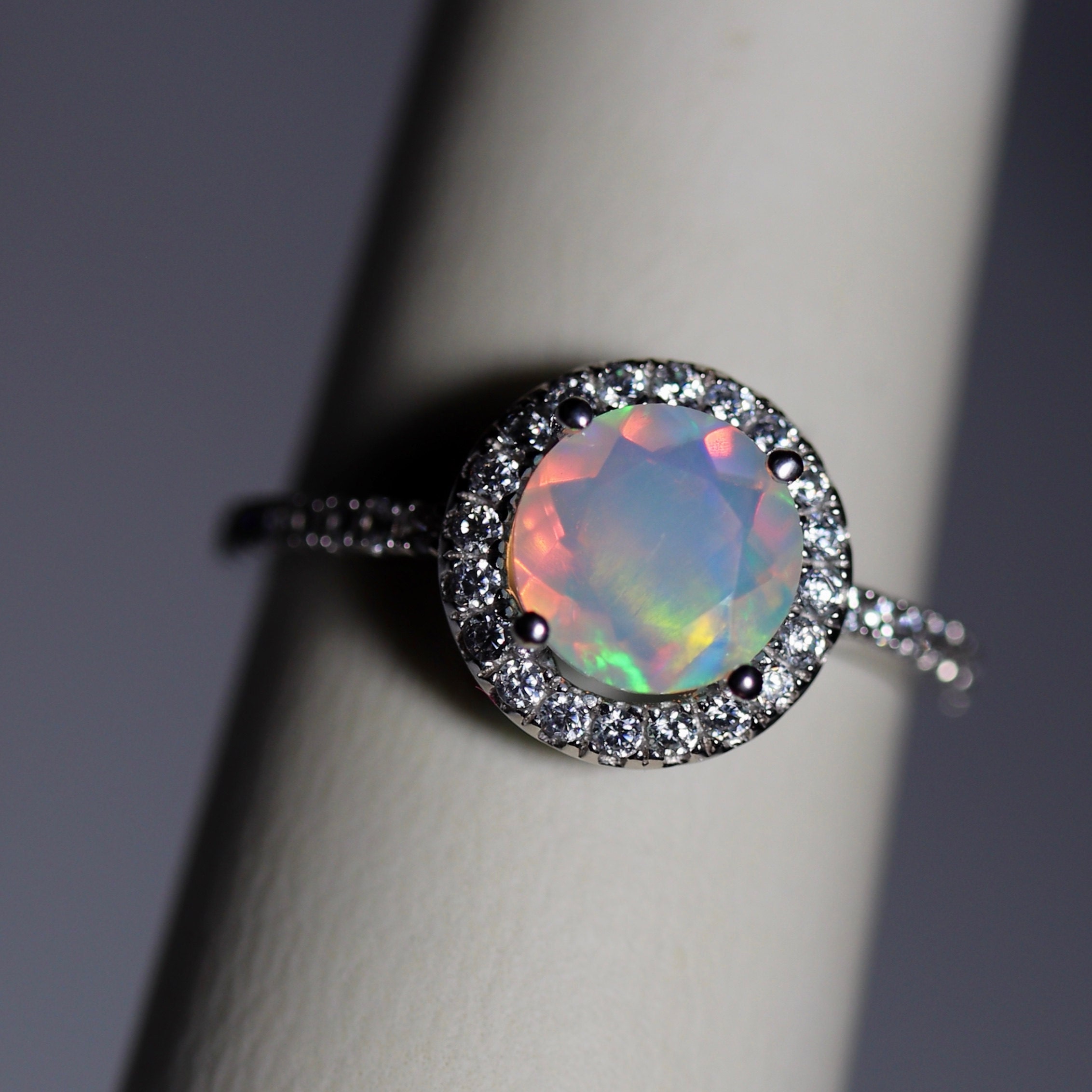 White gold halo rainbow opal engagement ring: classic and stunning!