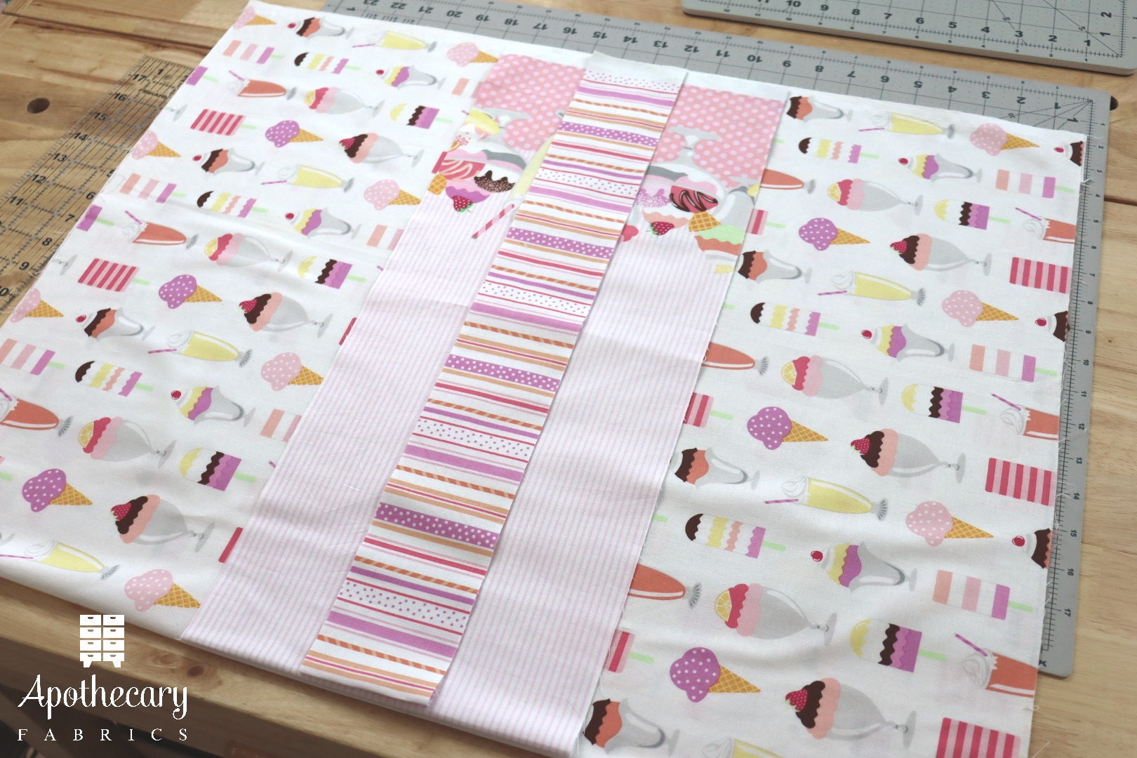 Three folded pieces of fabric arranged on a table.