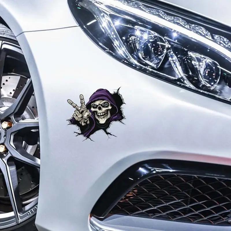 Skull breaking through fender with peace sign on a car.