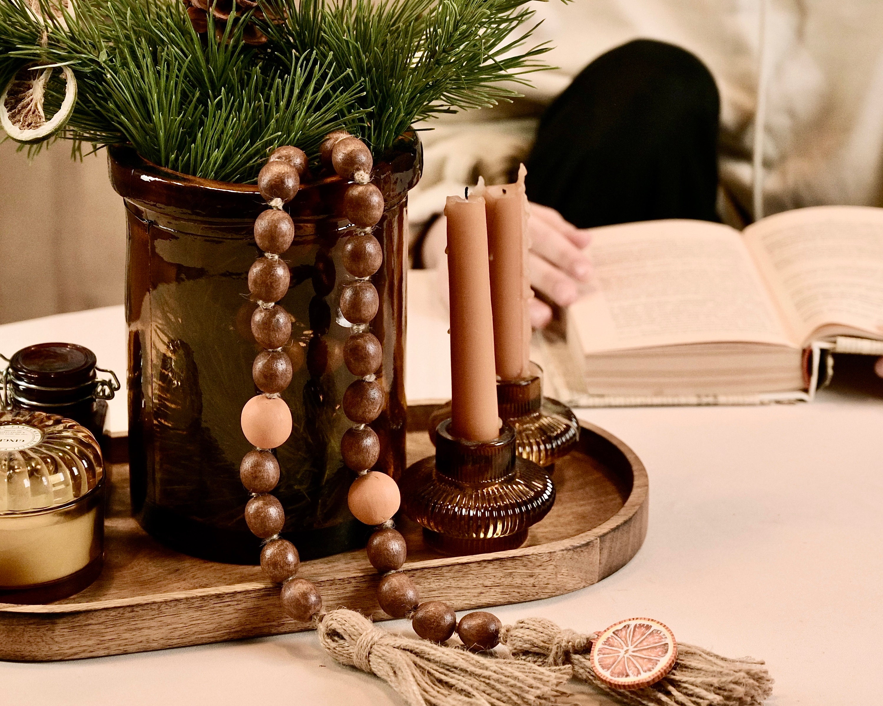 Imagine a table adorned with a centerpiece of pinecones, rustic wooden placemats, and charming burlap napkin rings, creating a captivating countryside holiday setting.