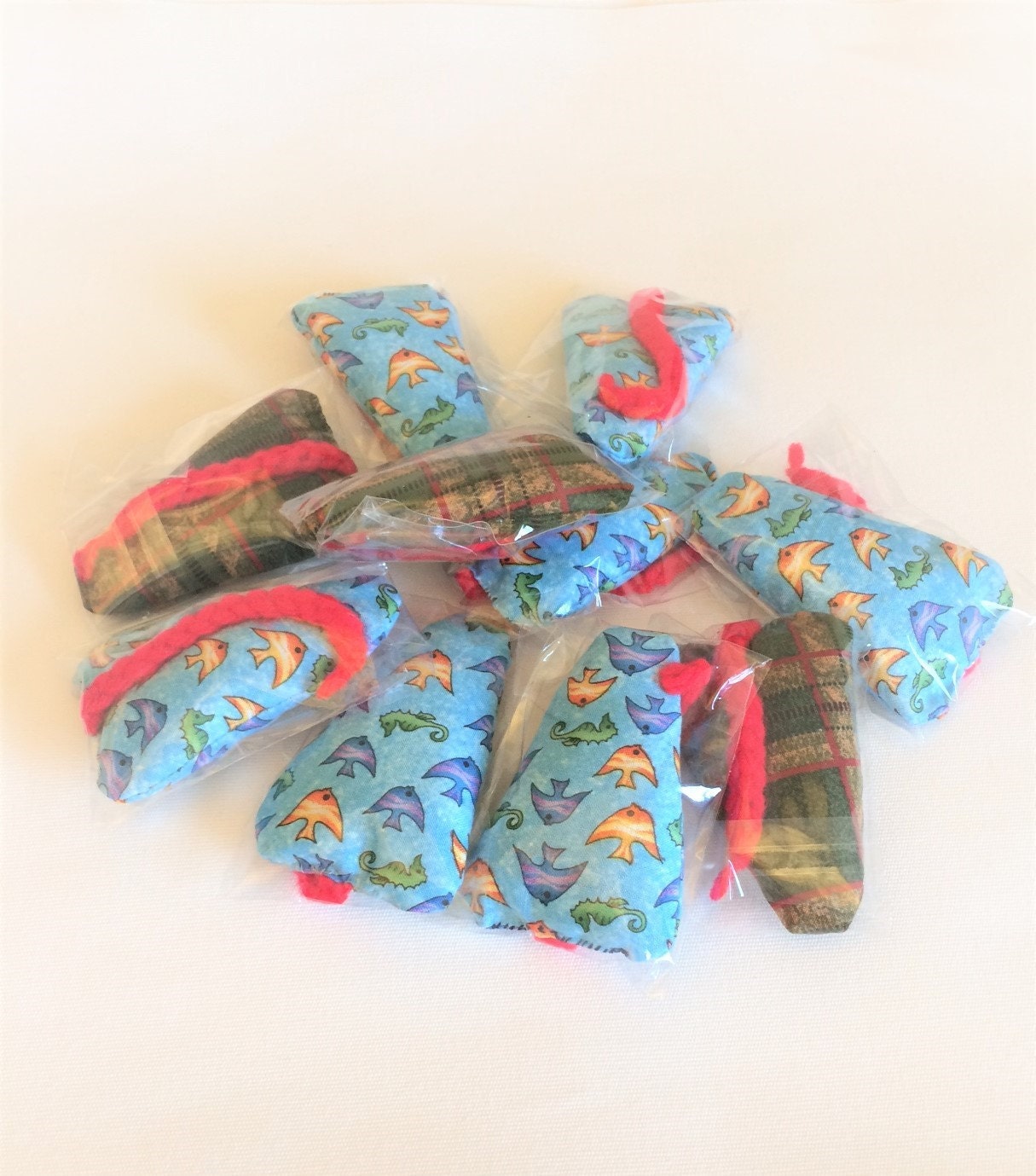 GiftsandHomeDecorUS Catnip mouse with signature red tails.