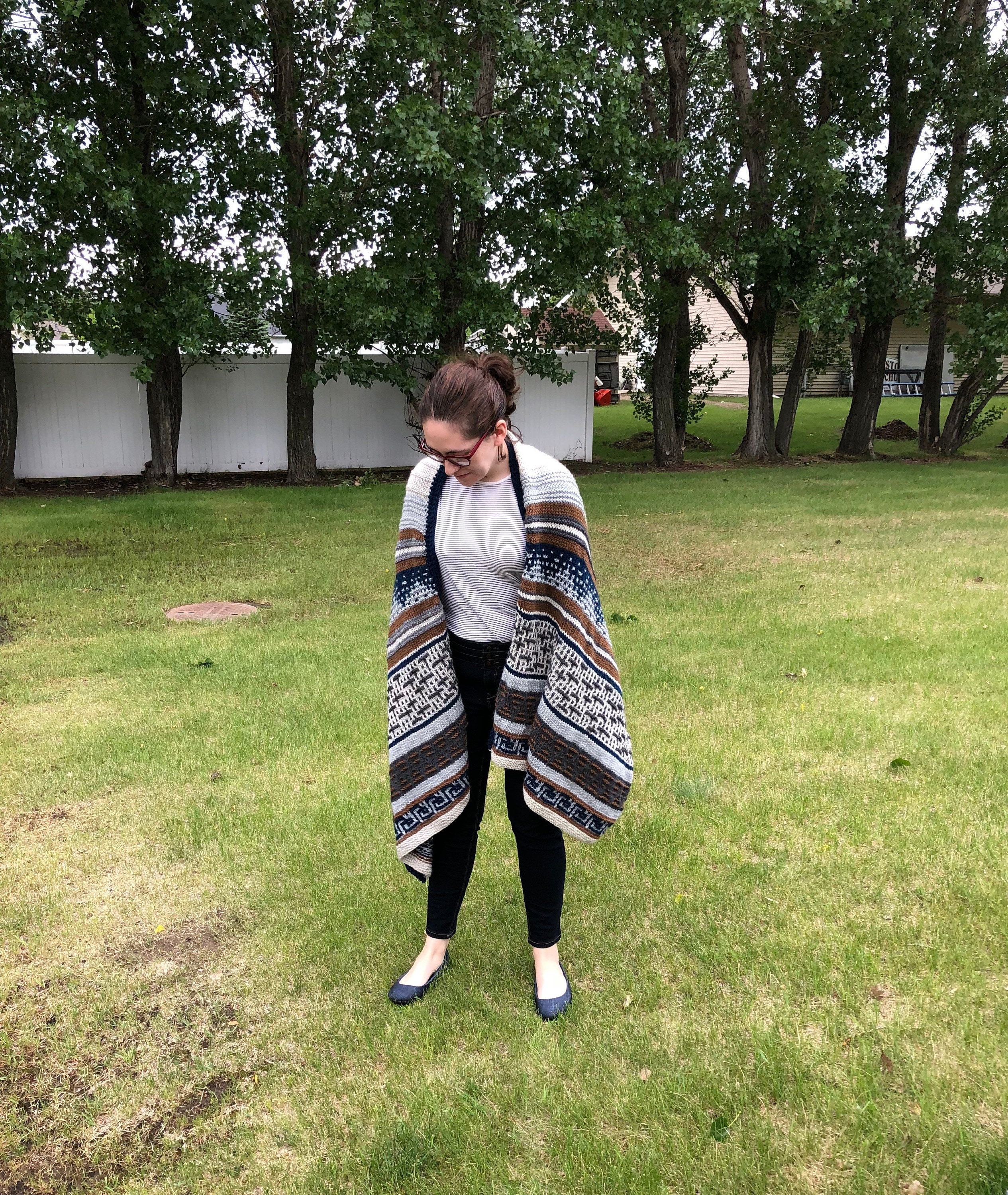 Woman wearing a big knitted wrap