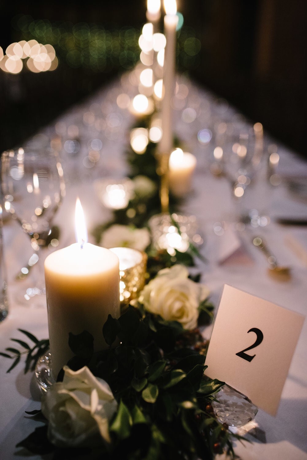 Wedding banquet table with candles and table number