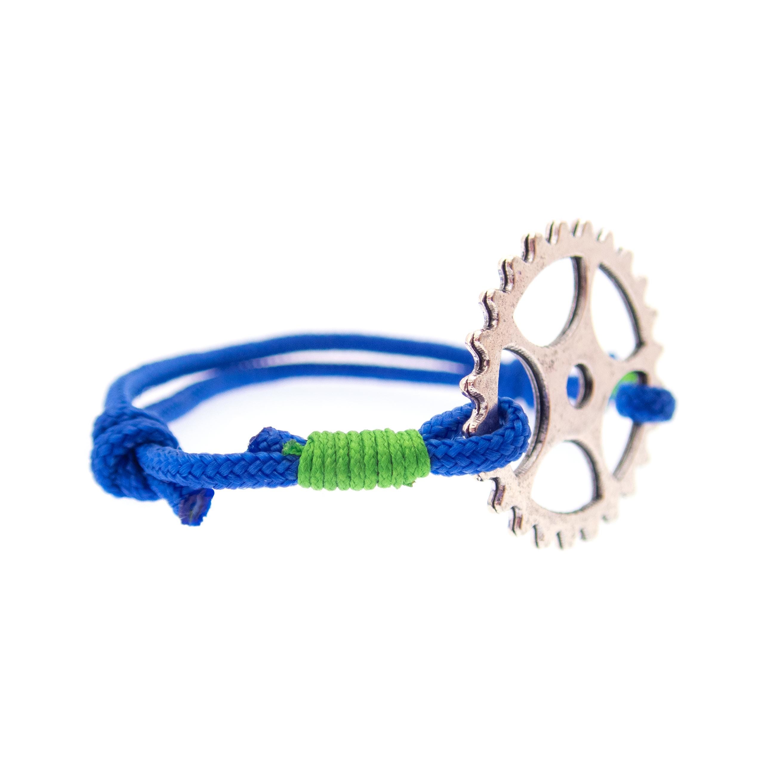 Minimalist blue rope bracelet with adjustable sliding knot and chainring charm, unisex biker jewelry for MTB riders, cyclists and motorbike enthusiasts.