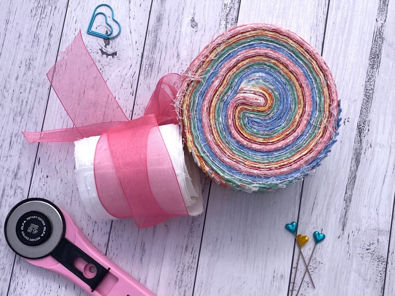 Rotary Cutter and Pretty Jelly Rolls ready to be washed and quilted