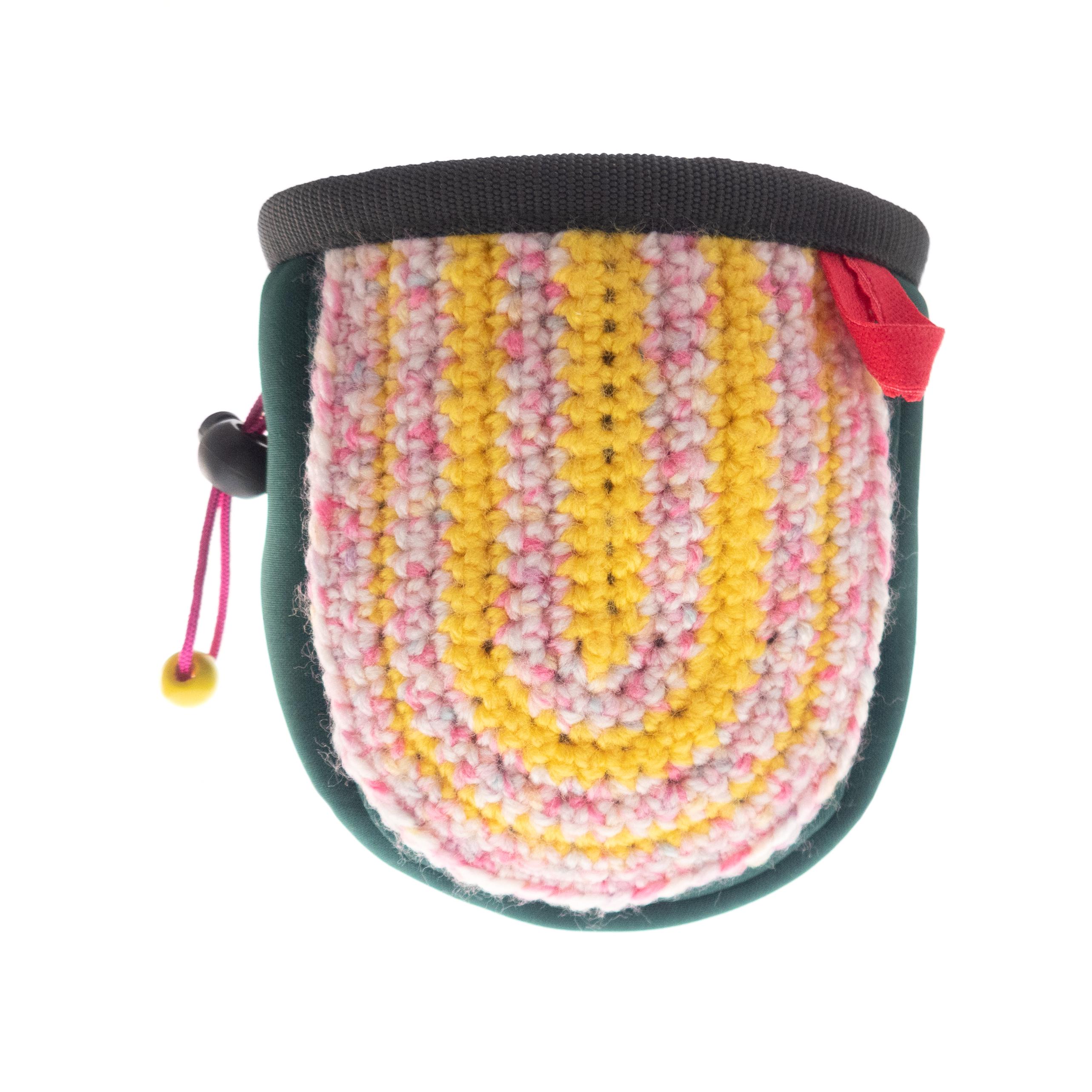 Nadamlada knit chalk bag designed for easy chalk access and reliable harness attachment while climbing
