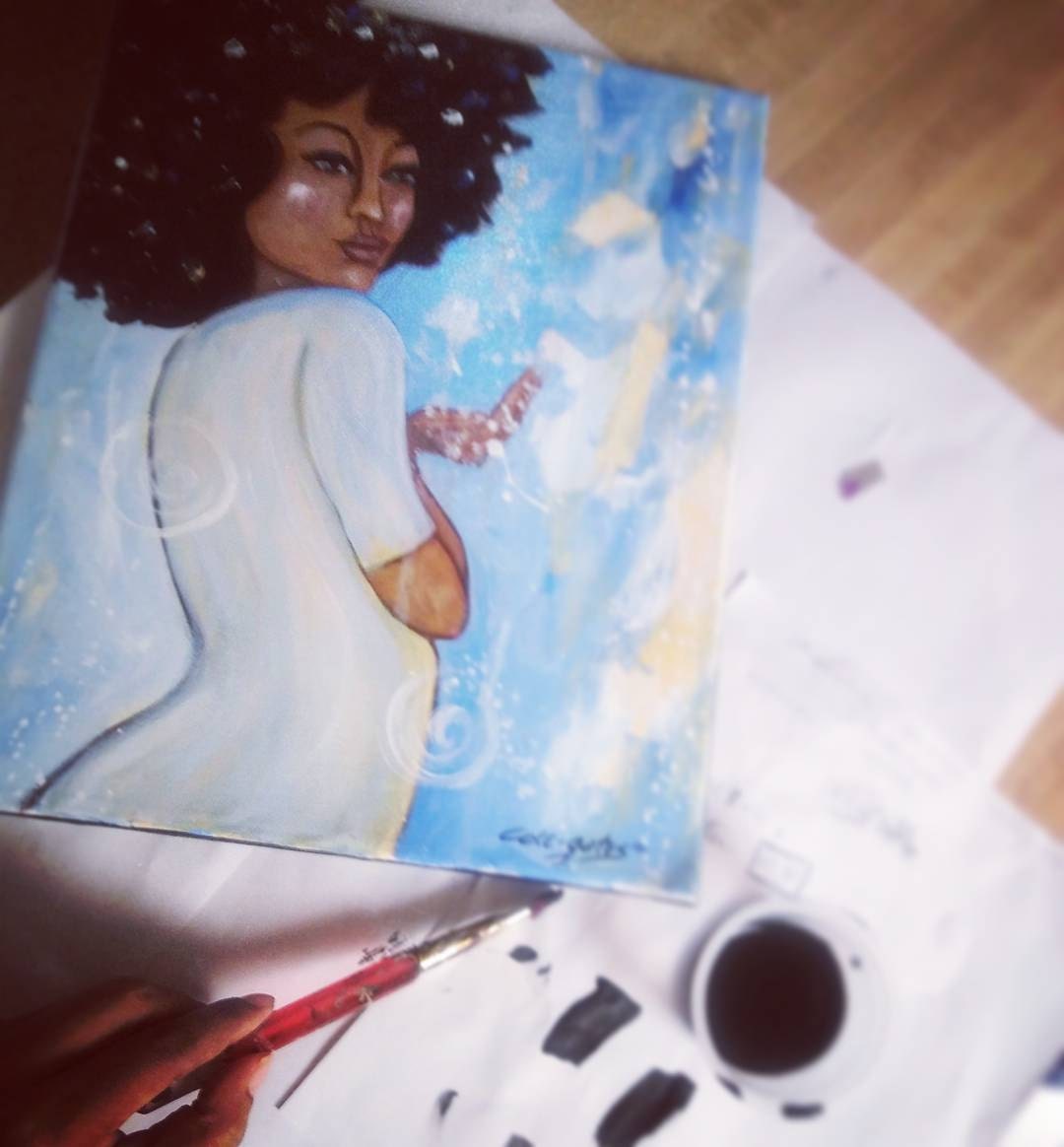 Artist hand with brush painting an artwork