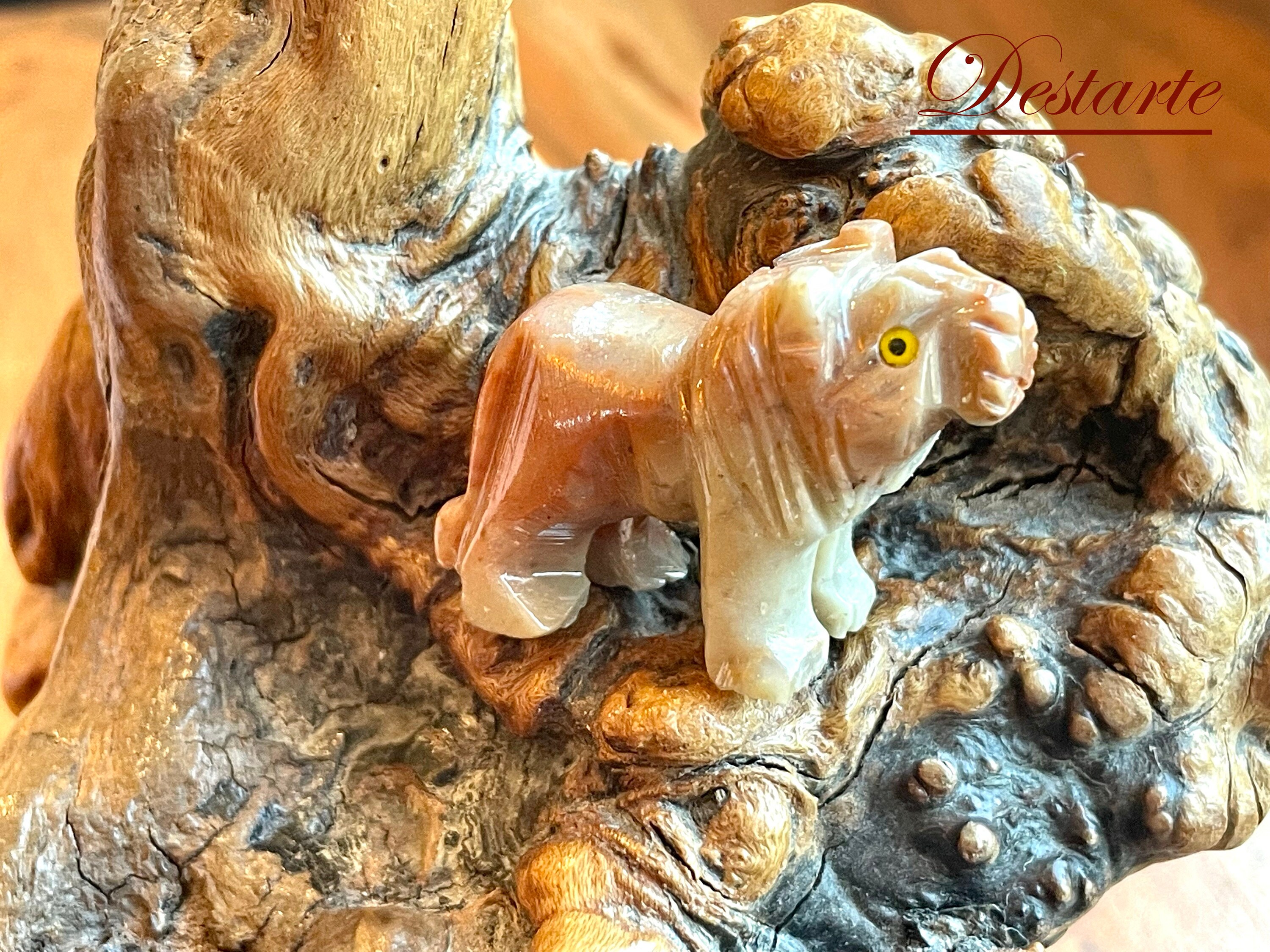 Hand carved agate Leo Fetish, with yellow eyes and colors of red and cream