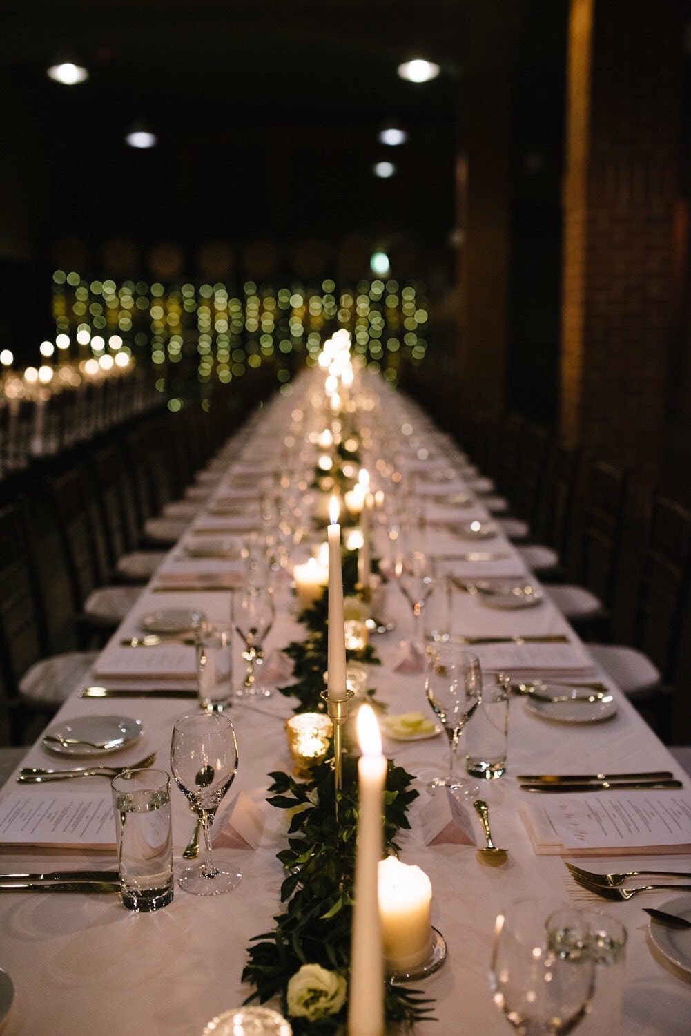 Photo of the dining table with candles and stationery place cards