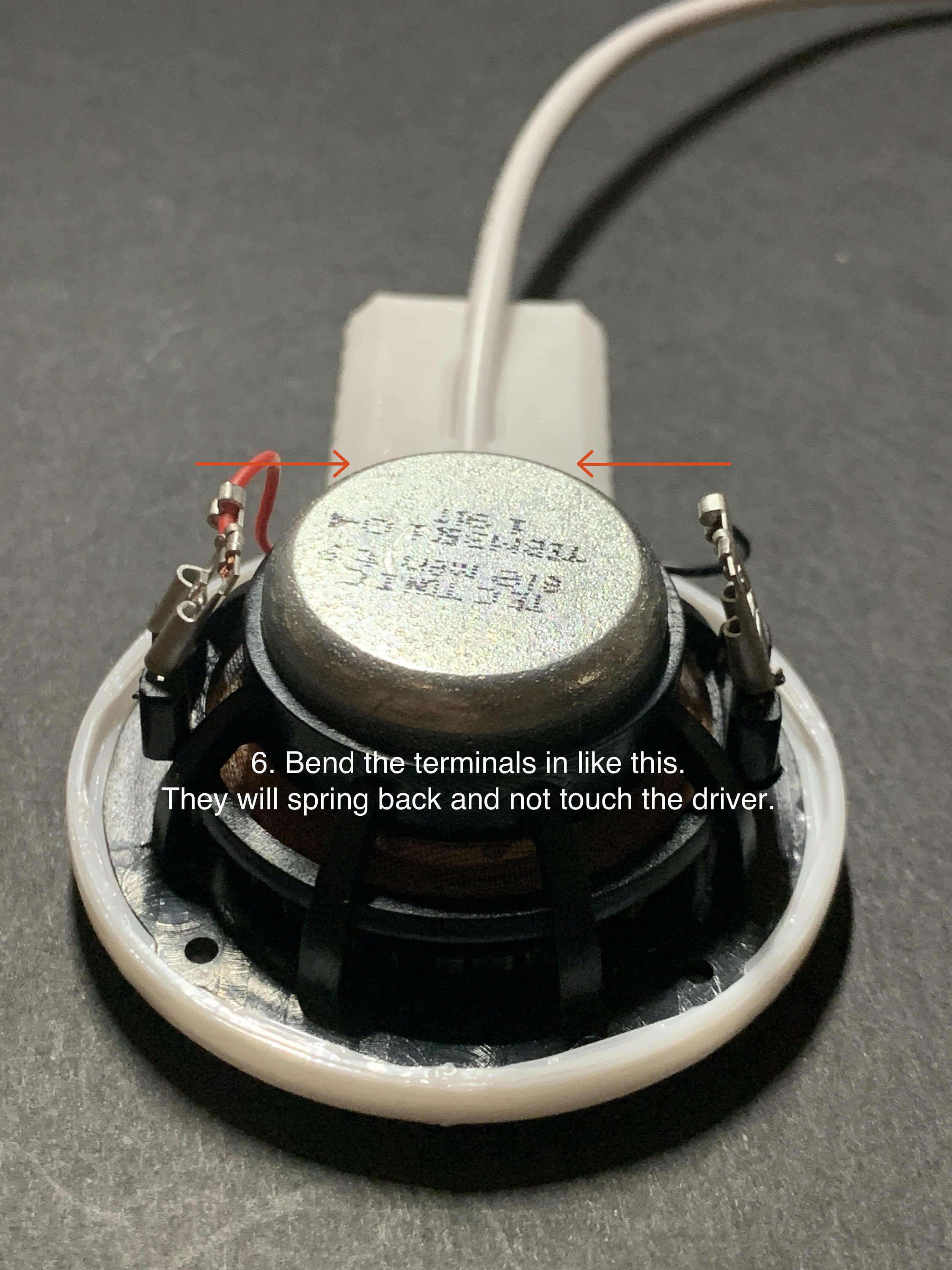 6. Bend the terminals in like this. They will spring back and not touch the driver.