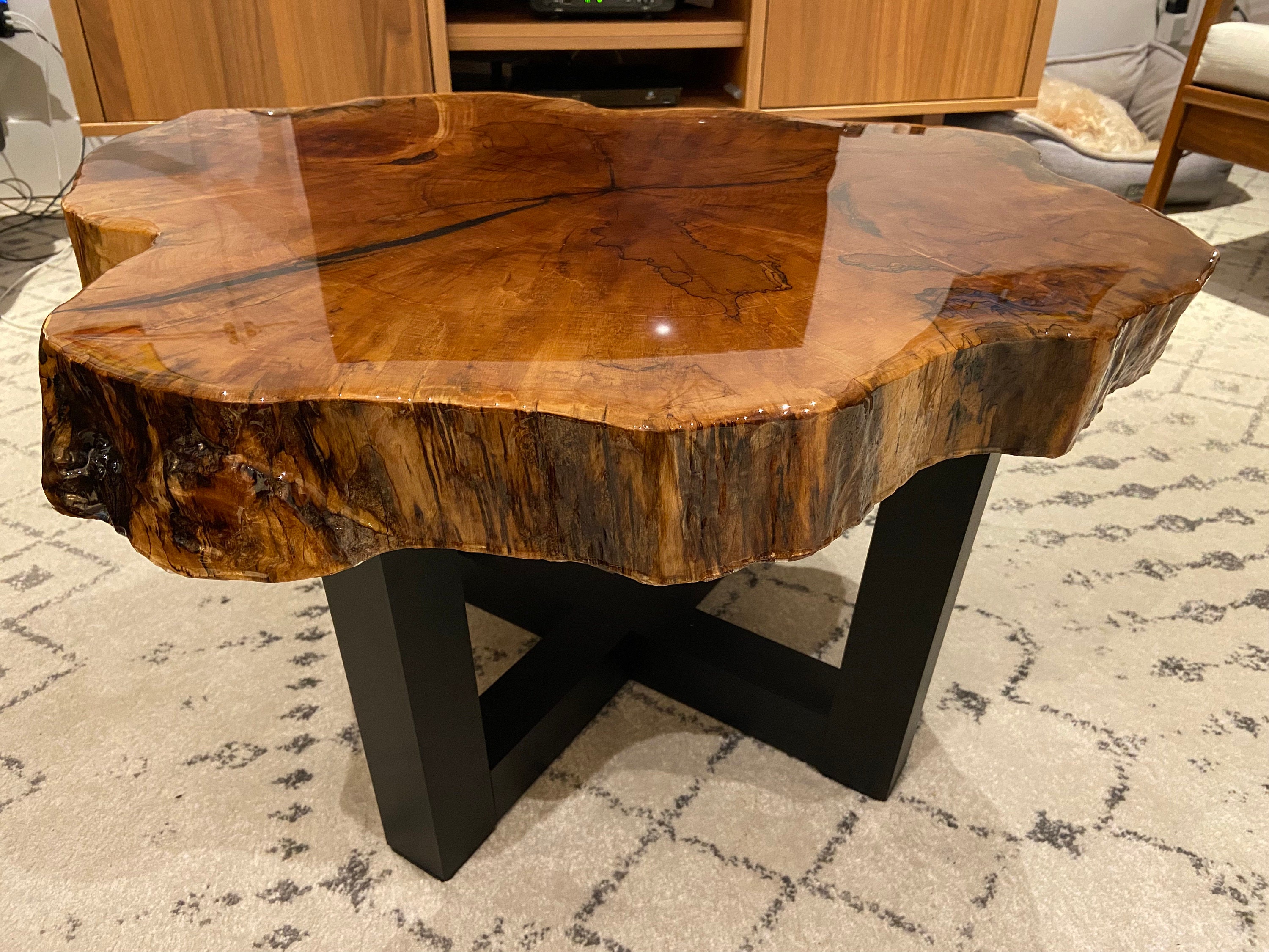 Narrow table legs give the top lift
