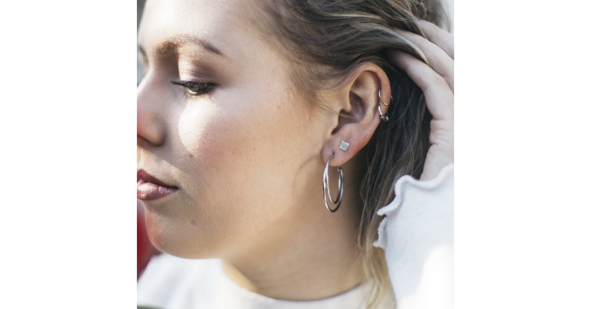 Pair bold statement pieces with fine and delicate ones