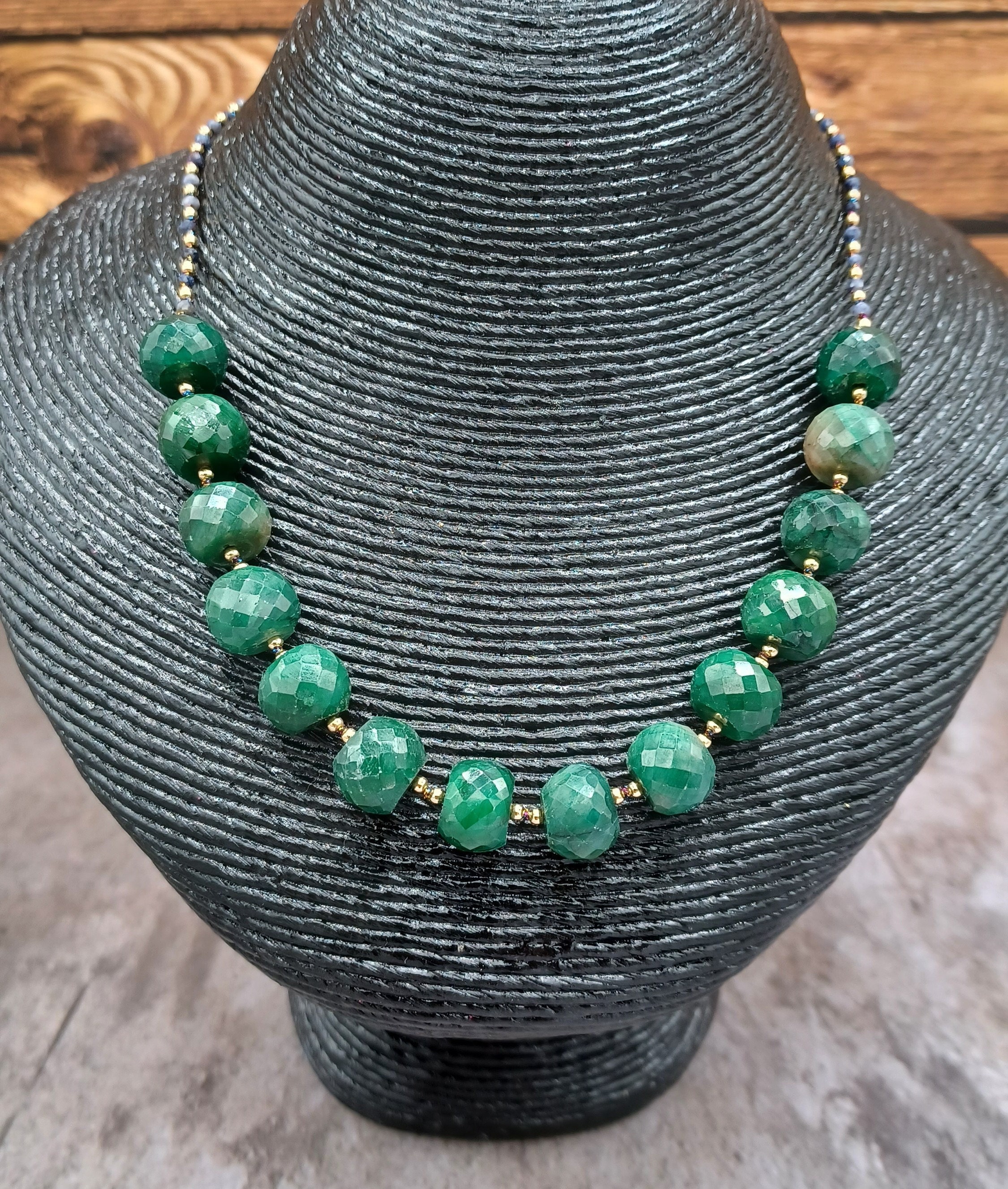huge emeralds surrounded by gold beads and accented with sapphire hand knotted necklace