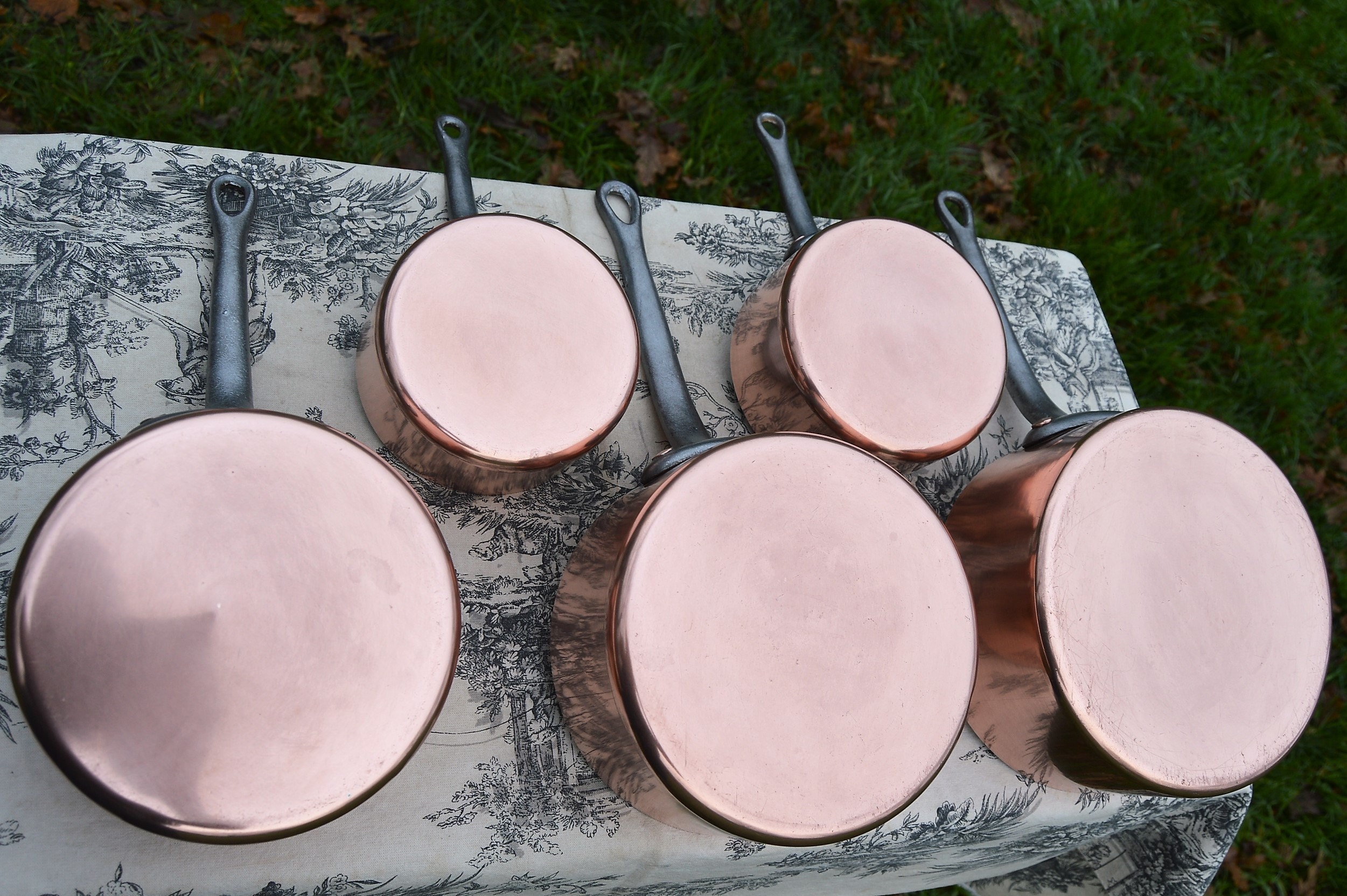 Shiny bottoms on vintage copper pans