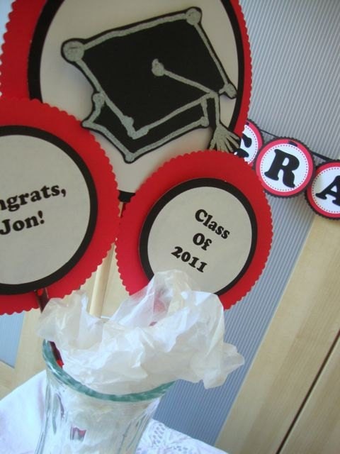 red and black graduation centerpiece with graduation cap