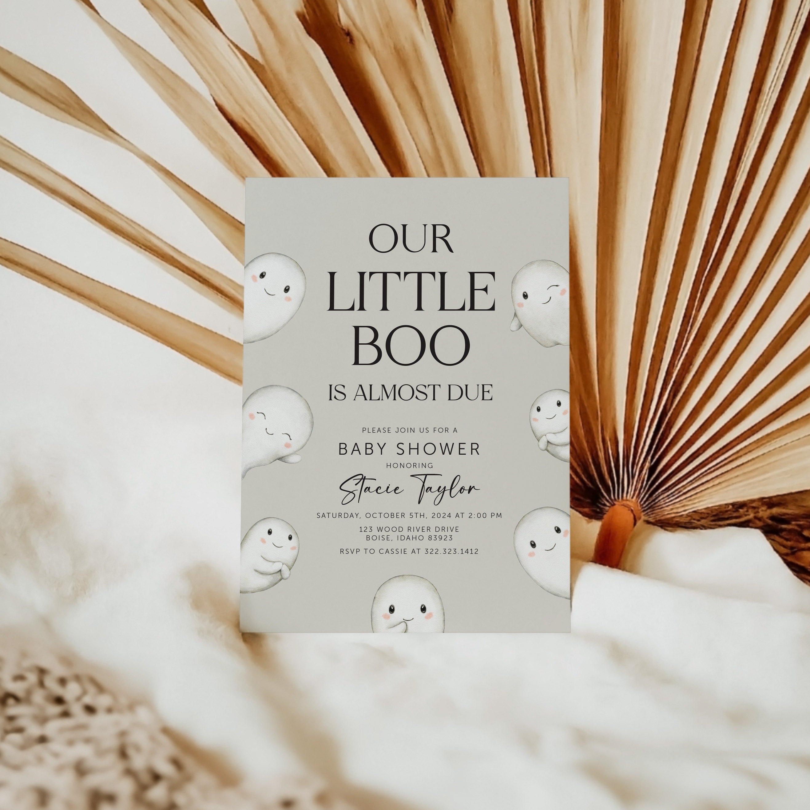 baby shower invitation in front of decoration