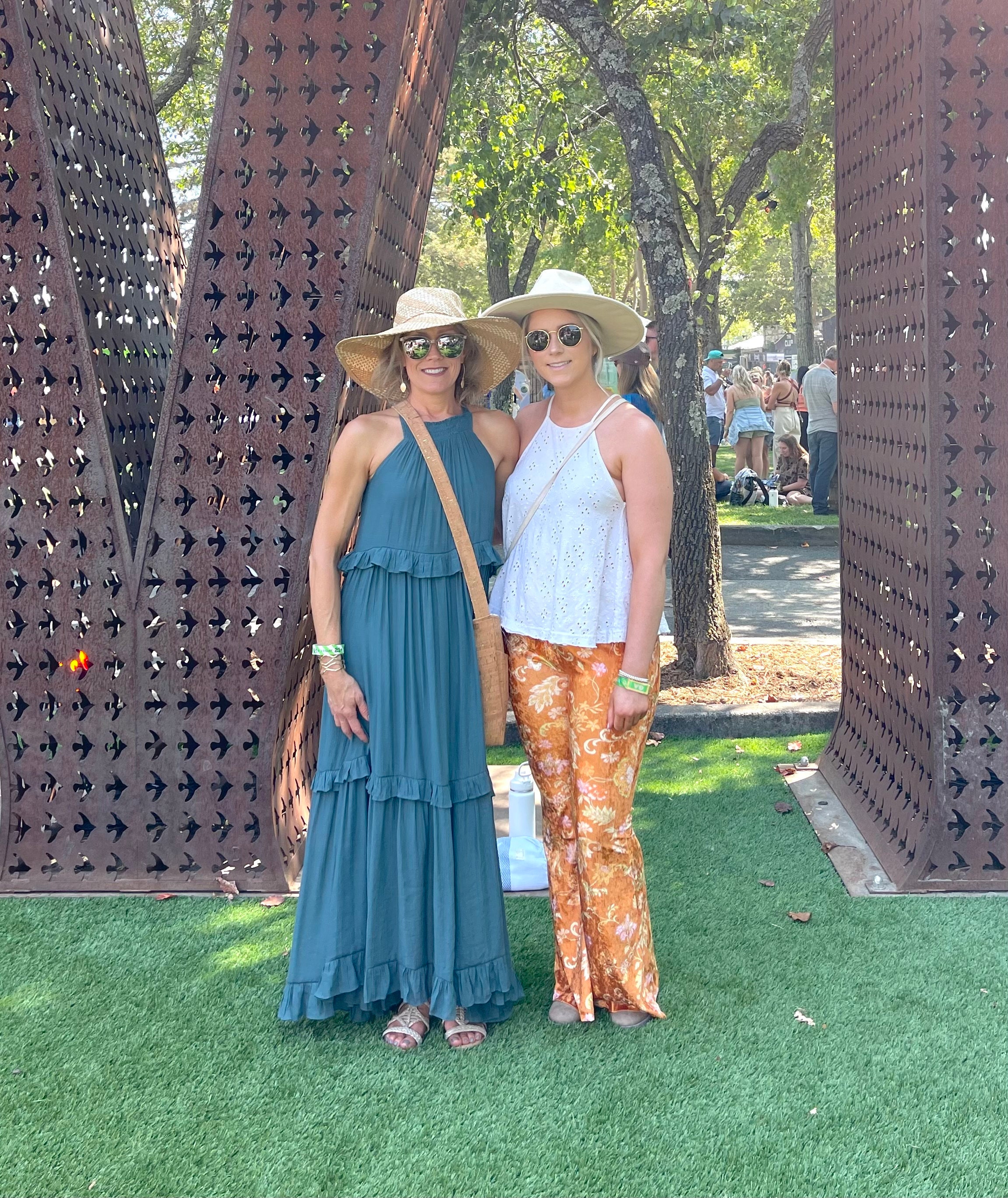 Girls in a maxi sundress, boho pants and wide brim hats