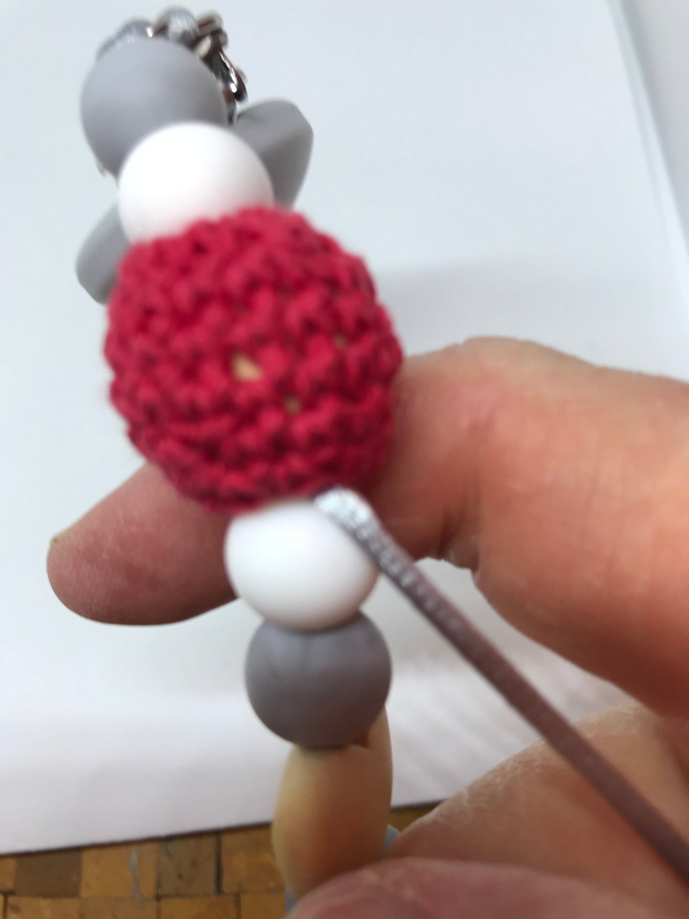 Work the tail back through the beads at least 1 1/2.