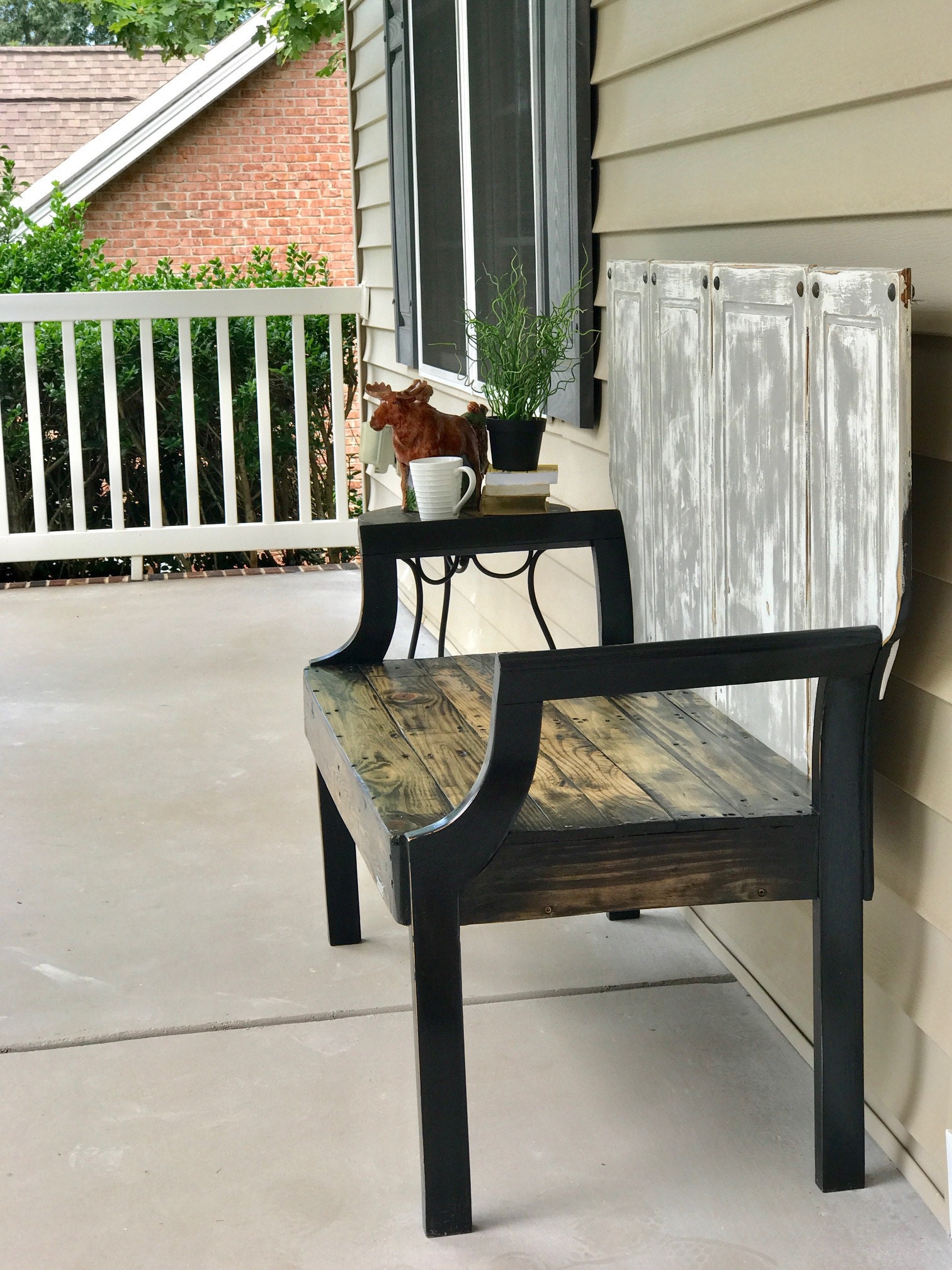 Made from two chairs, pallet boards, and cabinet doors from a 60s bungalow.