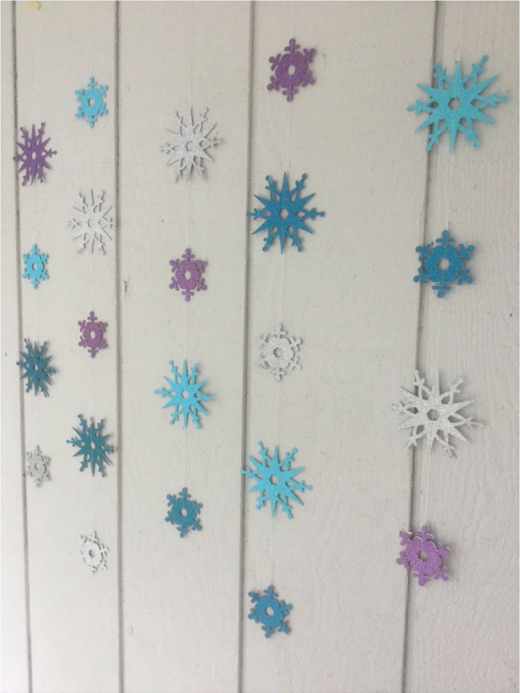 turquoise, teal, purple and silver glitter snowflakes for a Frozen party