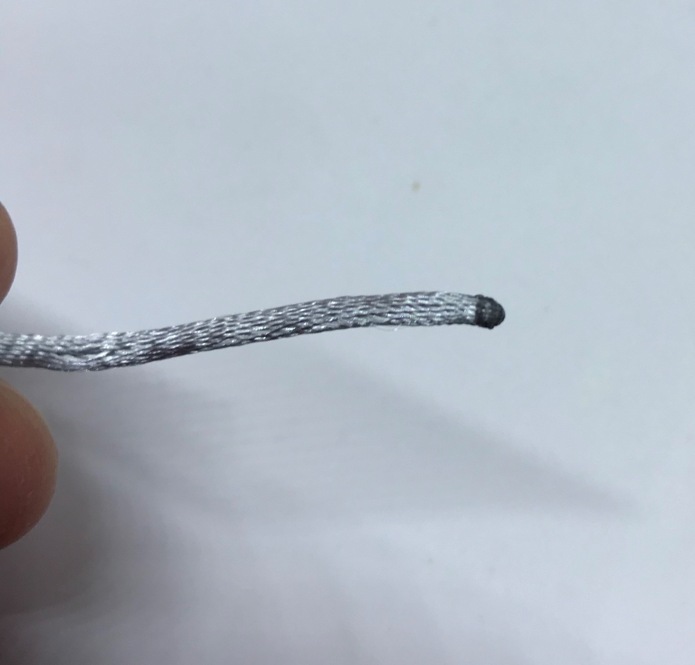 A photo of the cord that has been singed on the end.