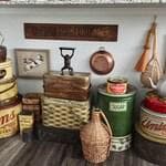 Carolyn’s unique display under the kitchen peninsula combines practical storage with seasonal cross-stitch showcases.