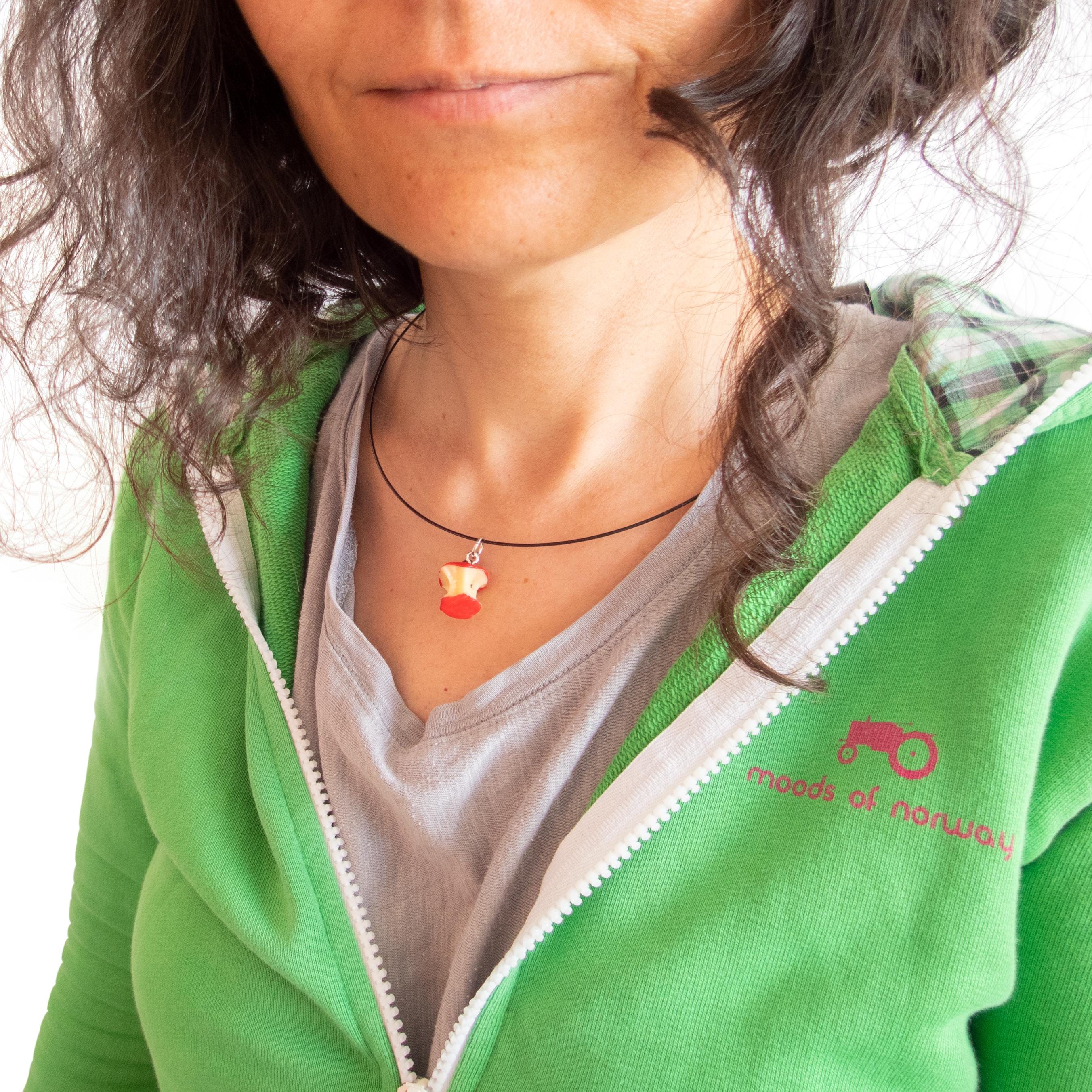 Nadamlada necklace featuring a delicate apple pendant, unisex jewelry with a subtle symbolic touch
