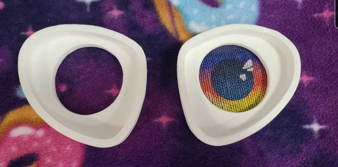 A stock image showing my white resin eye frames with a sunset colored mesh in one side.