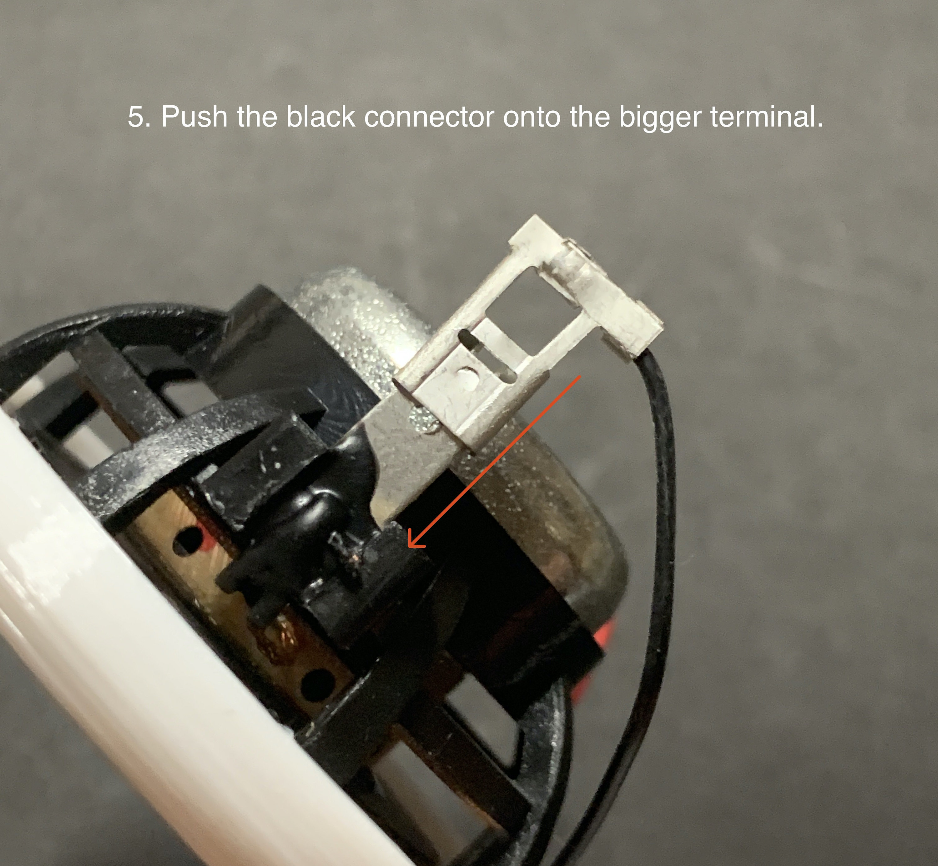 5. Push the black connector onto the bigger terminal.