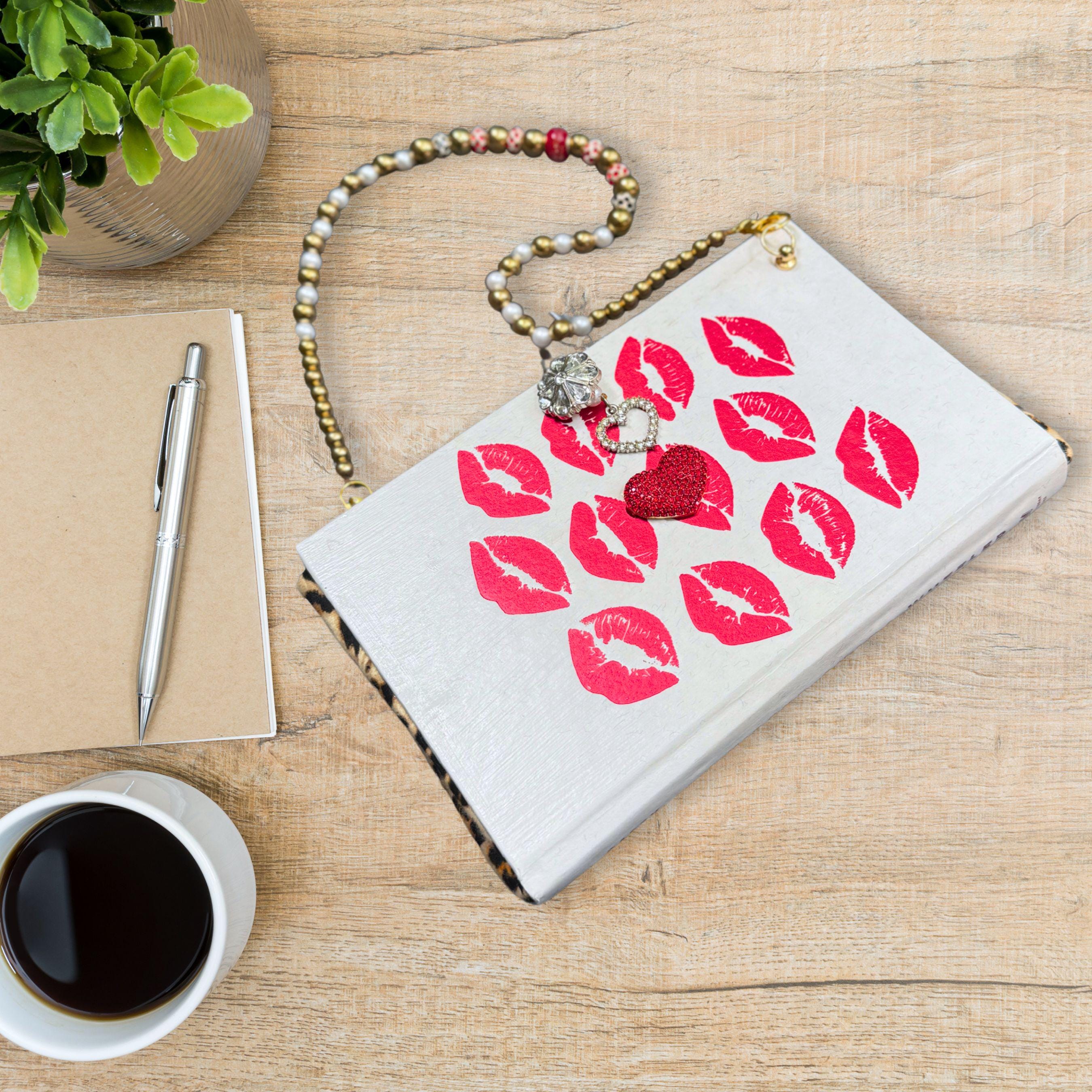 I Kissed Shara Wheeler book purse with lips, a sparkly heart, a heart clasp and a sparkly clasp hook