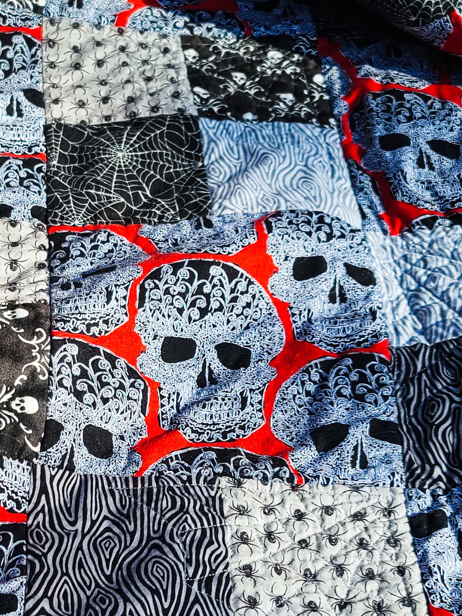 black skulls on a red background quilt