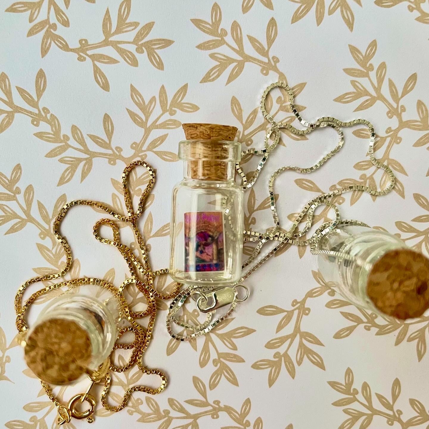 miniature book in a bottle necklace, featuring Harry Potter and the Sorcerers Stone